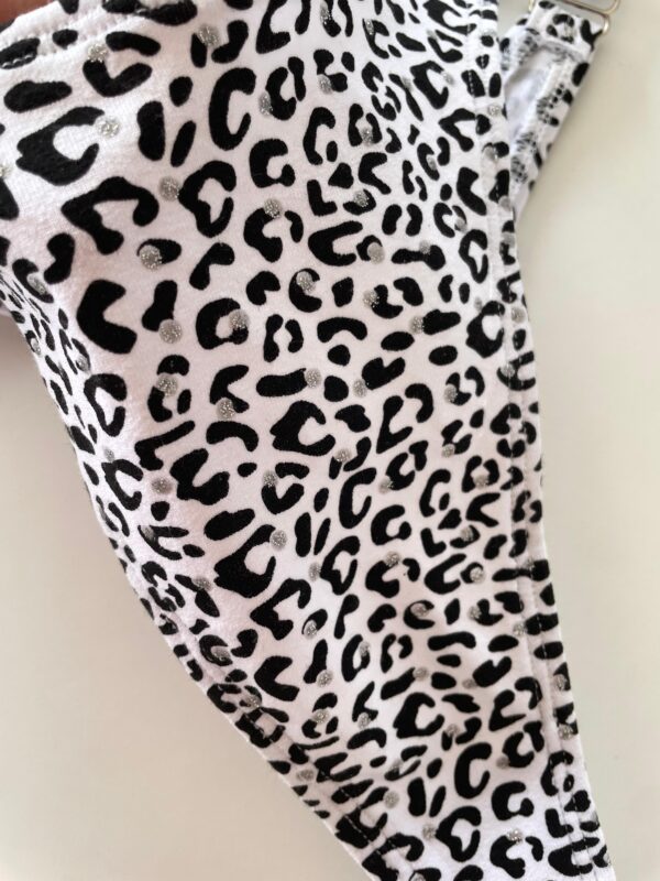 WhatsApp Image 2026-08-15 at 3.15.49 PM (1) COLALESS ALGODON - PRINT NEGRA CON GLITTER- TALLE 2 - LR56